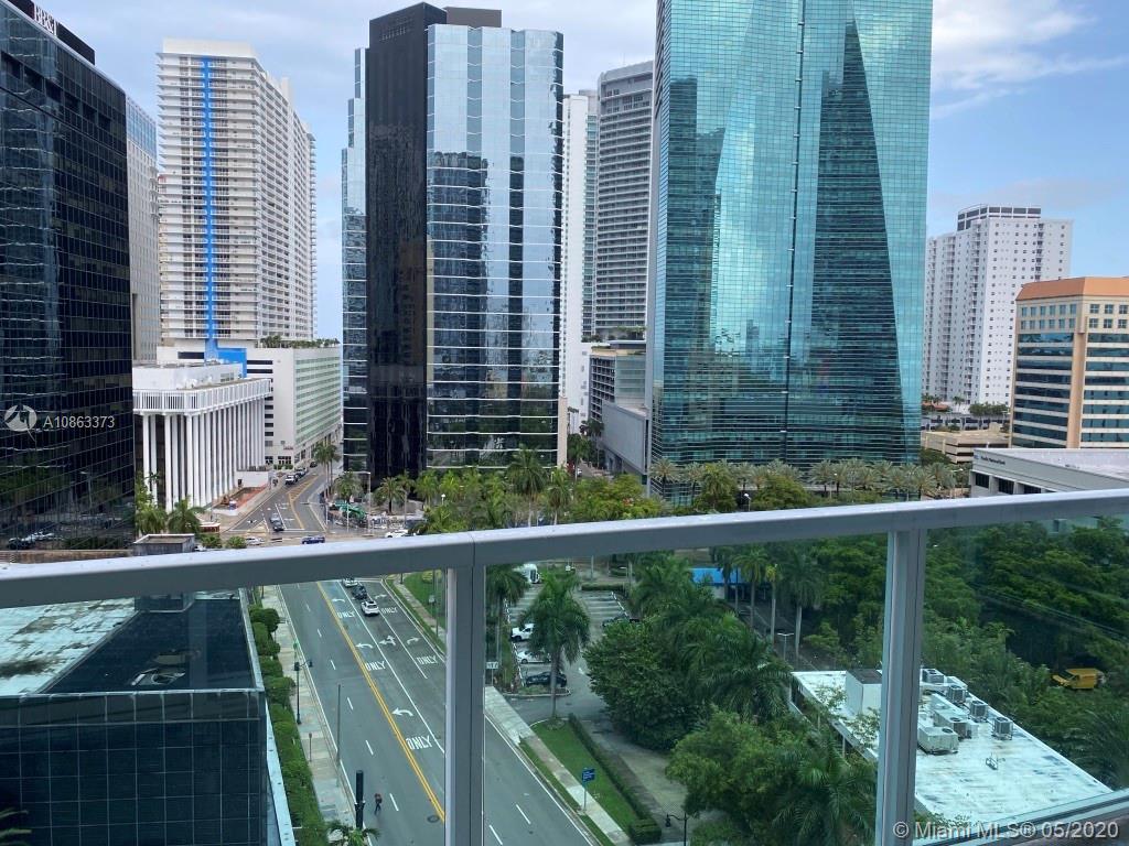 Enjoy this spacious and bright corner condo with 2 bedrooms and 2 full bathrooms; unit features wood flooring throughout and ceramic floor in kitchen and bathrooms, large size washer and dryer. Enjoy great city views from its wraparound balcony. Located in a full amenity building in the desired Brickell area. Easy to show, courtesy key at the front desk.