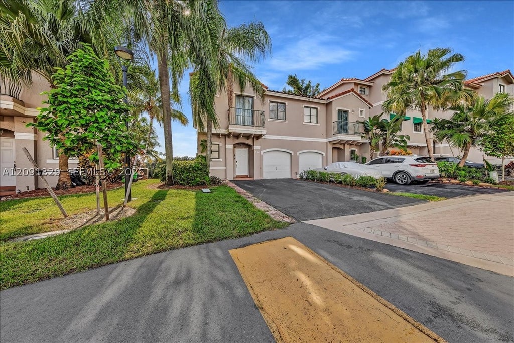 Photo of 1408 NW 126th Ave #1408, Sunrise, FL 33323 (MLS # A12091329)