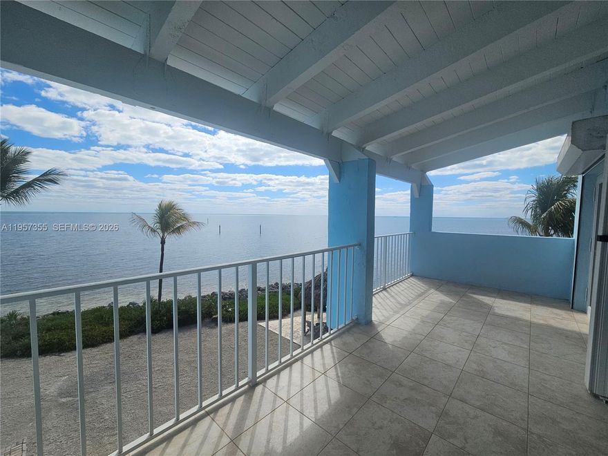 Luxury Ocean Front End Unit. The best views from the complex in this townhome with 50 ft deeded slip and boat lift. Indulge in the vibrant ocean colors of turquoise blues and greens from every room. Awaken to awe-inspiring sunrises accompanied by refreshing ocean breezes. This hidden gem has the best views in the exclusive Key Largo Yacht Club with the boat slip just steps away. Convenience, peace and quiet are yours in this private community of only 24 units. Turn-key property and furnished, ready to enjoy, Solid 3 1/4 Hardwood floors throughout. Impact windows & doors in addition to shutters. Multiple balconies in front and back. Covered parking for two vehicles. For boating enthusiasts, a 50-foot deeded boat slip with a 4-post lift provides direct ocean access from your private dock, conveniently located behind your garage. The expansive owner's suite spans the entire third level, offering a tranquil sanctuary with its own balcony, an additional screened terrace, and stunning views of the ocean and marina. Whether you're a water sports enthusiast or a lover of serene vistas, this townhome is a dream come true. Located at the heart of Key Largo with Keys' vibrant coastal lifestyle, enjoy proximity to world-class reefs, fishing hotspots, sandbars, and renowned waterfront dining. Easy access to Adams Cut, your adventures can extend seamlessly to the bay, providing endless opportunities for exploration.