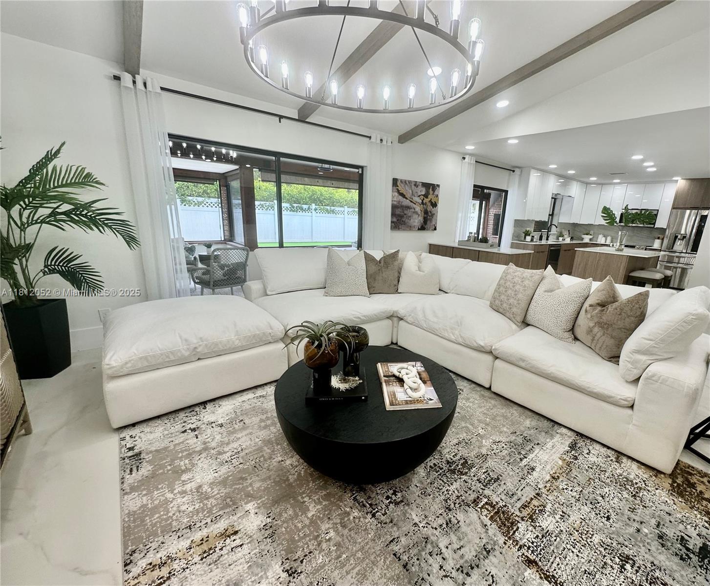 BACK ON MARKET DUE TO BUYER FINANCING FALLING THROUGH. Welcome to your dream home in the heart of Coral Springs! This stunning 4BD/2BA pool home has been beautifully renovated w/ high-end finishes & thoughtful upgrades throughout. Enjoy an open-concept layout w/ wood-beamed ceilings, brand new floors, LED lighting & designer chandeliers. The kitchen features quartz countertops, S.S. appliances & an island w/custom cabinetry. Both bathrooms have been fully remodeled w/ modern finishes. The spacious primary suite offers a walk-in closet & spa-like bathroom. Step outside to your private oasis complete w/ a sparkling pool, pizza oven, built in BBQ & mango trees.Nest A/C & 7-year-old roof. Conveniently located near top-rated schools, parks, dining, & shopping. Don’t miss this one-of-a-kind gem!