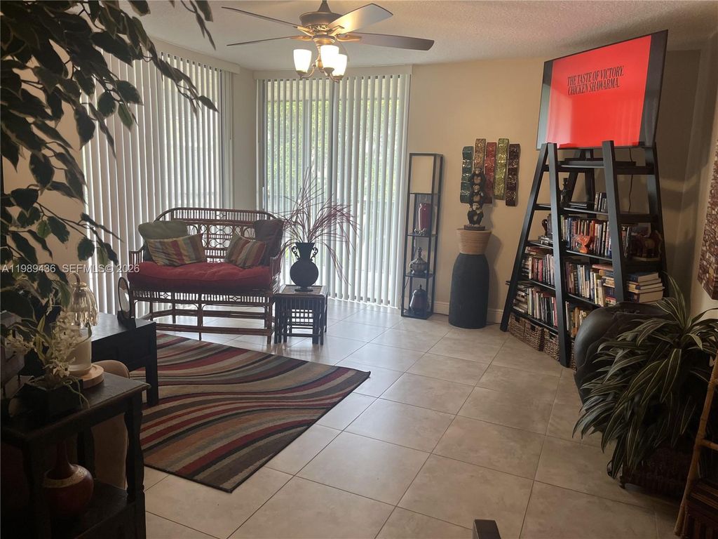 Photo of 10401 W Broward Blvd #301, Plantation, FL 33324 (MLS # A11989436)