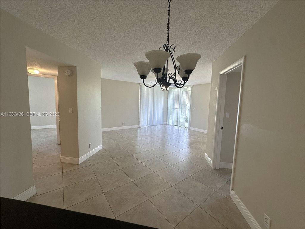 Photo of 10401 W Broward Blvd #301, Plantation, FL 33324 (MLS # A11989436)