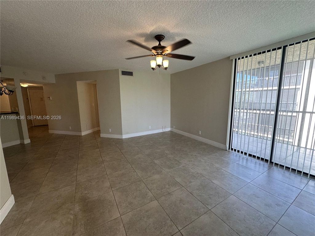 Photo of 10401 W Broward Blvd #301, Plantation, FL 33324 (MLS # A11989436)