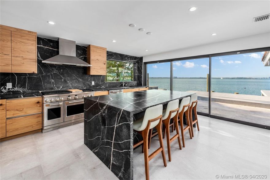 One story renovated house on Venetian Islands steps from the Standard Hotel. 2,464 sqft living area, 3 bedrooms, 2 bathrooms, floor to ceiling sliding glass doors with breathtaking water views. Chef style kitchen, La Finestra impact windows and doors, pantry, laundry. Fully furnished with 4 parking spaces.