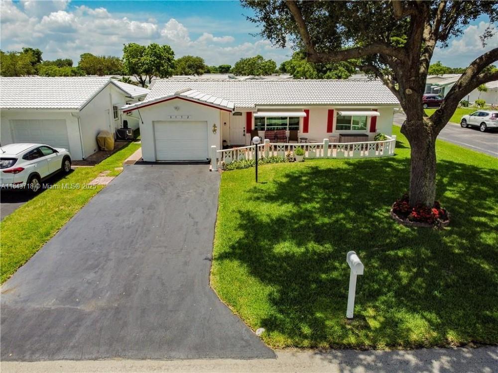 55+ community located on a corner lot. Newer impact windows, A/C, and gorgeous vinyl flooring throughout. Updated bathrooms with tile floors and a kitchen with all wood cabinets and quartz countertop and extended cabinet area, one car garage. A must-see with Stainless Steel Appliances. Titan tankless water heater. Enjoy the relaxed atmosphere of this neighborhood. The Club House, Library and Gym, Spa, Sauna and Showers close to the Salt Water Pool. 720 credit score required.