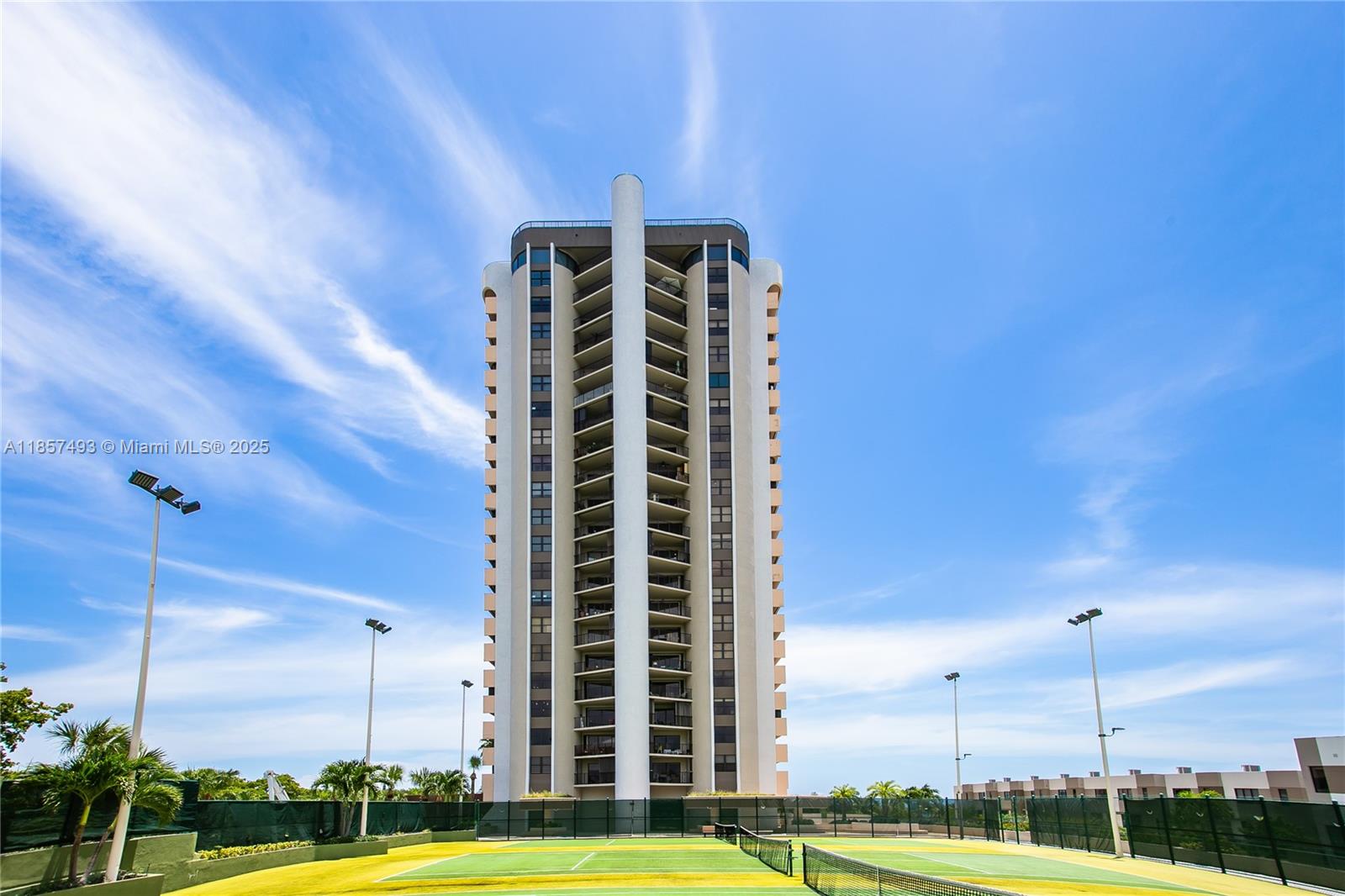 Breathtaking bay views and spectacular sunrises from this NE corner 2 BD rotunda unit on the sought-after 03 line at the Cricket Club. The unique rotunda space offers flexibility-ideal as a 3rd bedroom, office, entertainment area, or media room. Spacious open layout perfect for entertaining, with a large kitchen, ample storage, and two generous balconies. The primary suite features 2 bathrooms & 2 closets. Marble floors throughout and in-unit washer dryer. Enjoy full-service, resort-style living with a bayfront pool, gym, valet parking, tennis, basketball, playground and more. HOA includes air conditioning.