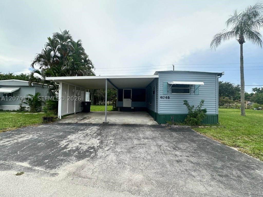 Photo of 4046 67th Ln, Riviera Beach, FL 33404 (MLS # A12079177)
