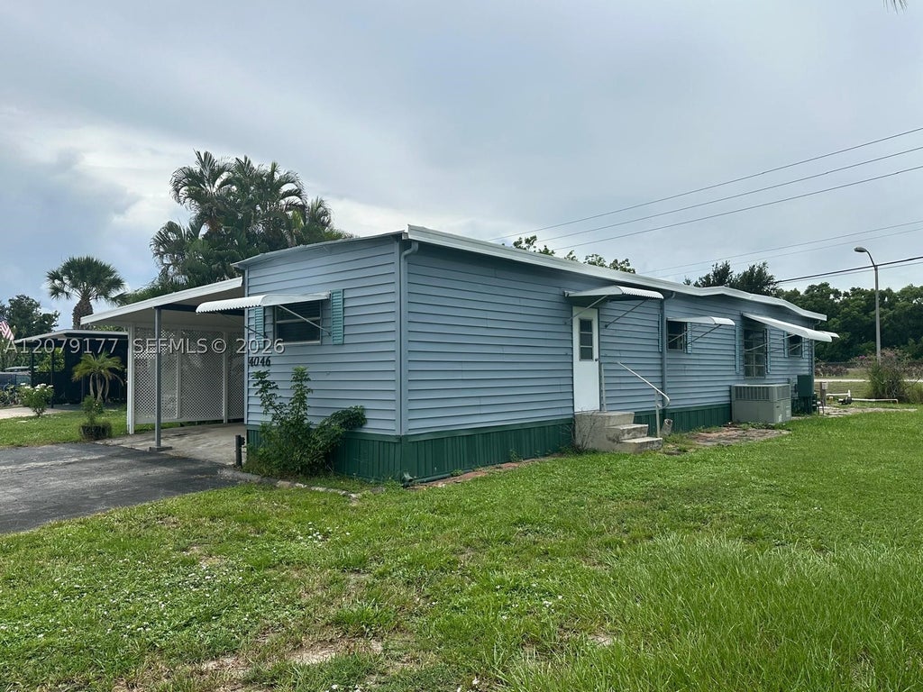 Photo of 4046 67th Ln, Riviera Beach, FL 33404 (MLS # A12079177)