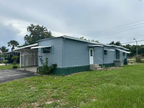 Photo of 4046 67th Ln, Riviera Beach, FL 33404 (MLS # A12079177)