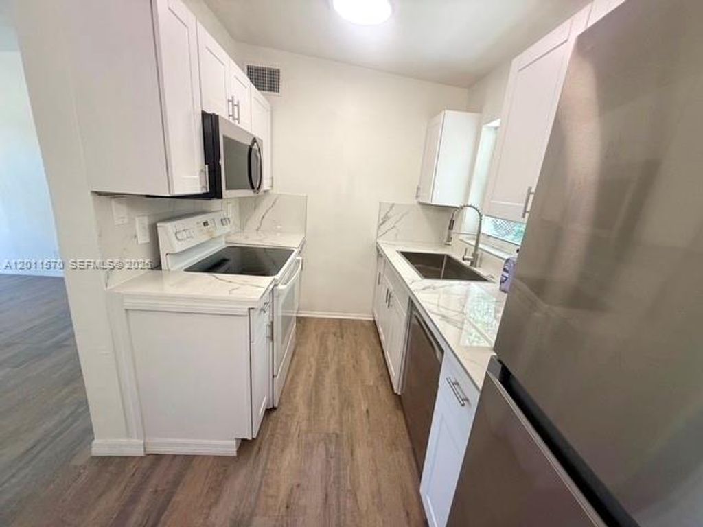 Photo of 530 Mentone Rd, Lake Worth, FL 33462 (MLS # A12011570)