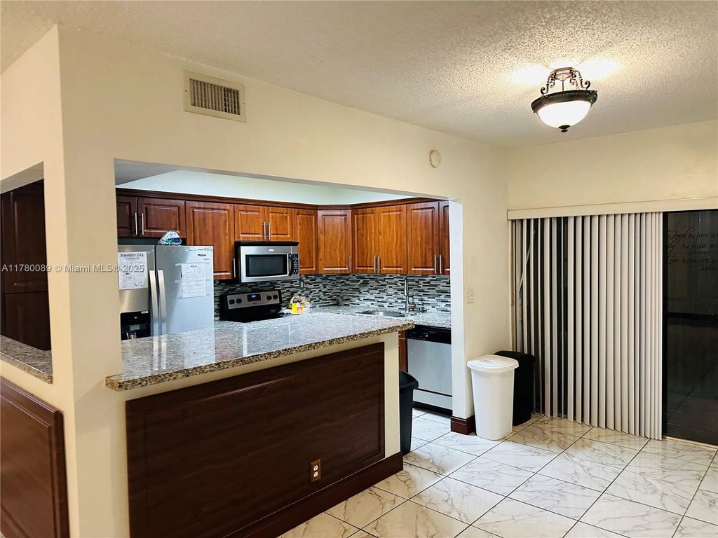 Photo of 4850 SW 63rd Ter #323, Davie, FL 33314 (MLS # A11780089)