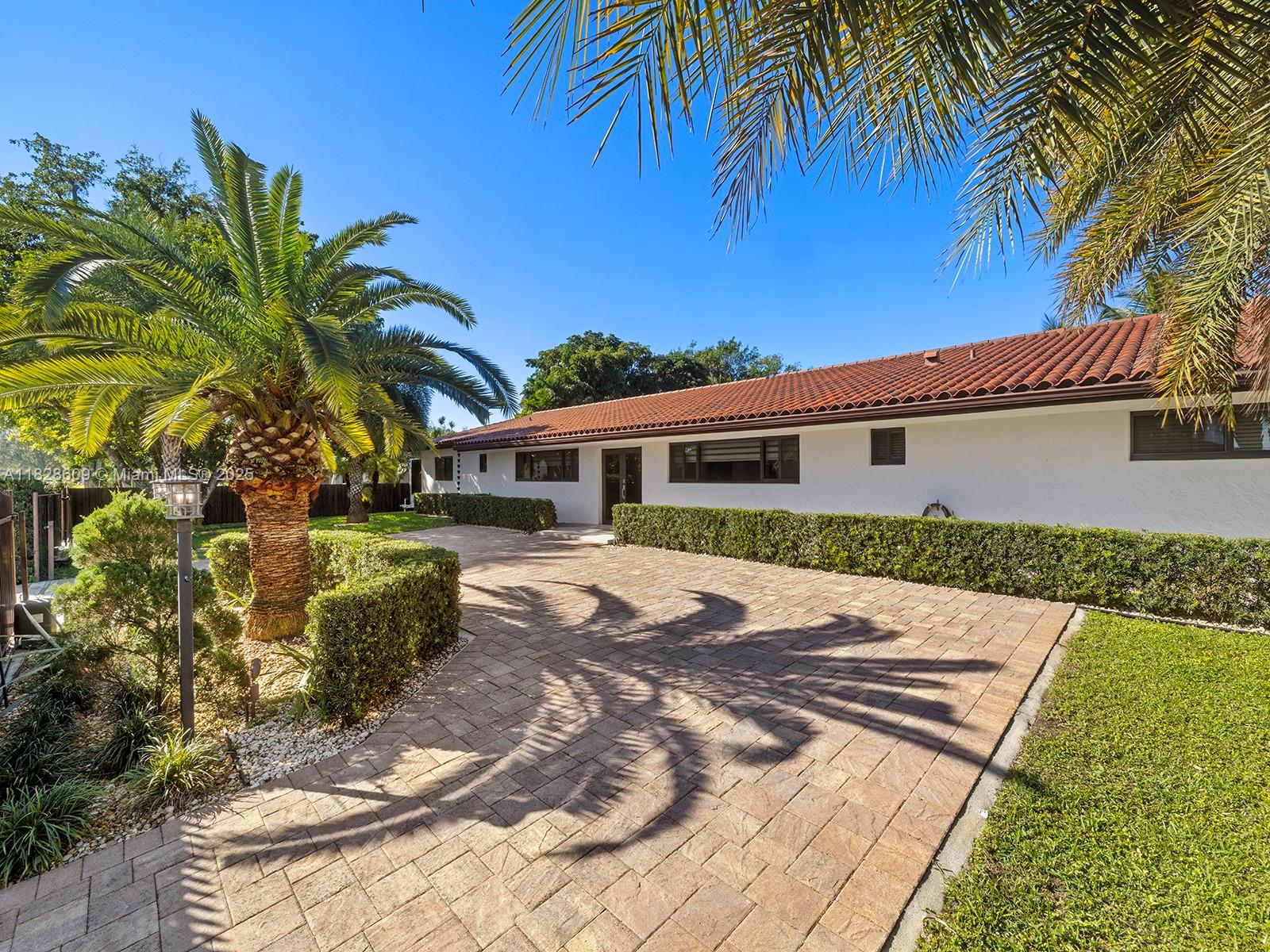 This unique 1.17-acre property offers a 3050 sq ft remodeled 4-bedroom,3-bath home with stainless steel appliances and custom closets throughout. In addition, there is a remodeled in-law quarter and a live-in trailer. Zoned for residential/commercial use with 220 ft of frontage on Griffin Road, it includes a fully operational plant nursery with permits, a workshop, and space for heavy equipment, trucks, boats, and RVs, which is divided from the residential area with the use of strategic landscaping and a separate gate for easy access. The property features TWO primary bedrooms, a remodeled pool, 3-car garage converted to a gym/game room +1 car garage, new roof, impact windows, electric gates, and full irrigation. Ideal for business and residential use, with endless potential for expansion.