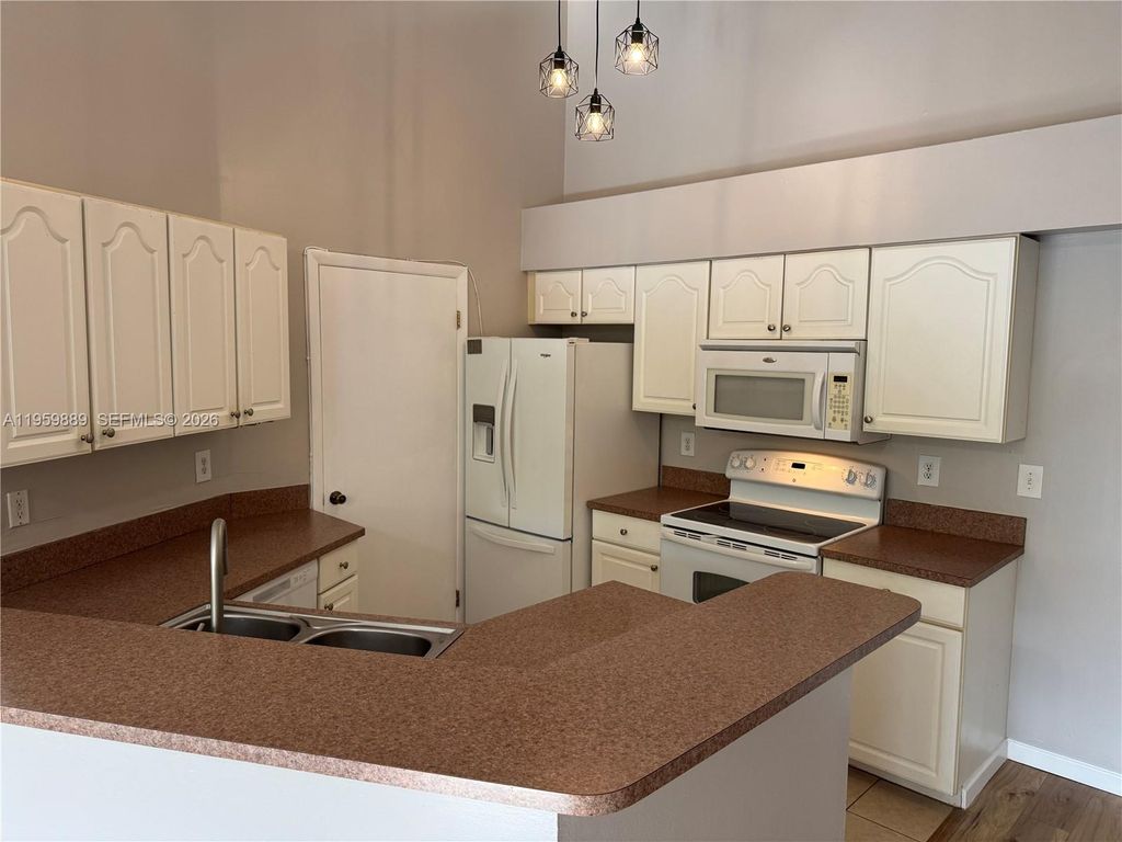 Photo of 9999 Summerbreeze Dr #108, Sunrise, FL 33322 (MLS # A11959889)