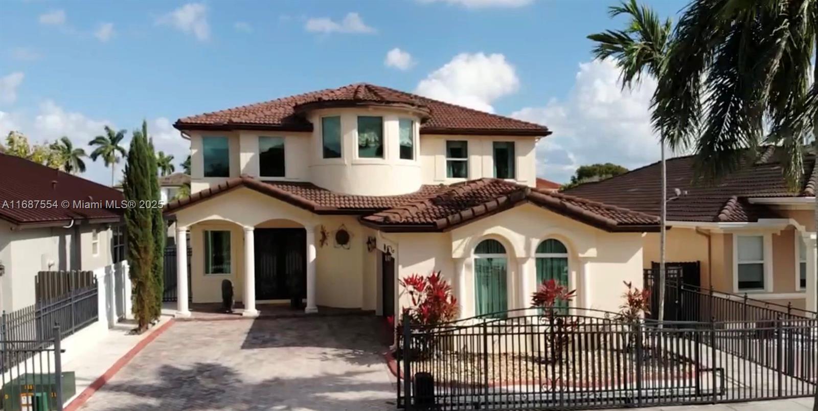 This stunning residence features a spacious living area highlighted by two elegant columns. The home boasts beautiful, luxurious walls decorated with moldings, providing a stylish touch.
The kitchen has granite countertops, stainless steel new appliances, and plenty of cabinet space.
The primary suite includes a spacious bathroom and a generous walk-in closet. There are two additional bedrooms, while the fourth bedroom (on the first floor) may be a home office.
Important upgrades: upscaled window treatments well-coordinated that match moldings and wall paintings. Marble floors, artistic metal fences with remote-operated gate, impact windows hurricane-resistant double front doors, and French doors in the back yard. Besides a beautiful panoramic lake and waterfront home's view.