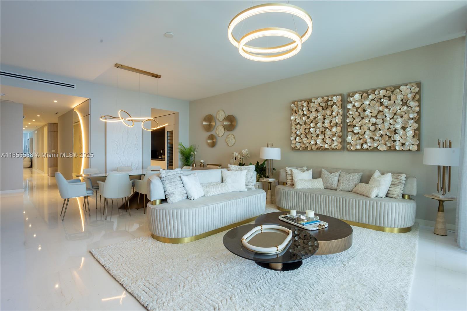 Luxury apartment at Aston Martin Residences with direct views of the Miami river & Bicayne Bay. Fully furnished and decorated by Steven G. 3 bedroom + Den + staff room and 4.5 baths, every room has on suite bathroom, walking closet & electric blinds. Top-of-the-line Gaggenau appliances, private foyer, 2 parking spaces.. Enjoy world - class amenities in one of Miami's most iconic building, steps from the best dining, shopping & entertainment.