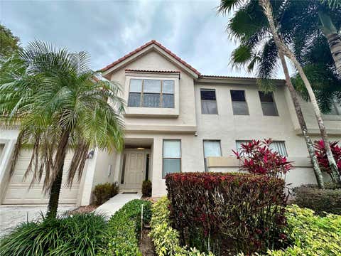 Photo of 5790 Coach House Cir #E, Boca Raton, FL 33486 (MLS # A12015719)