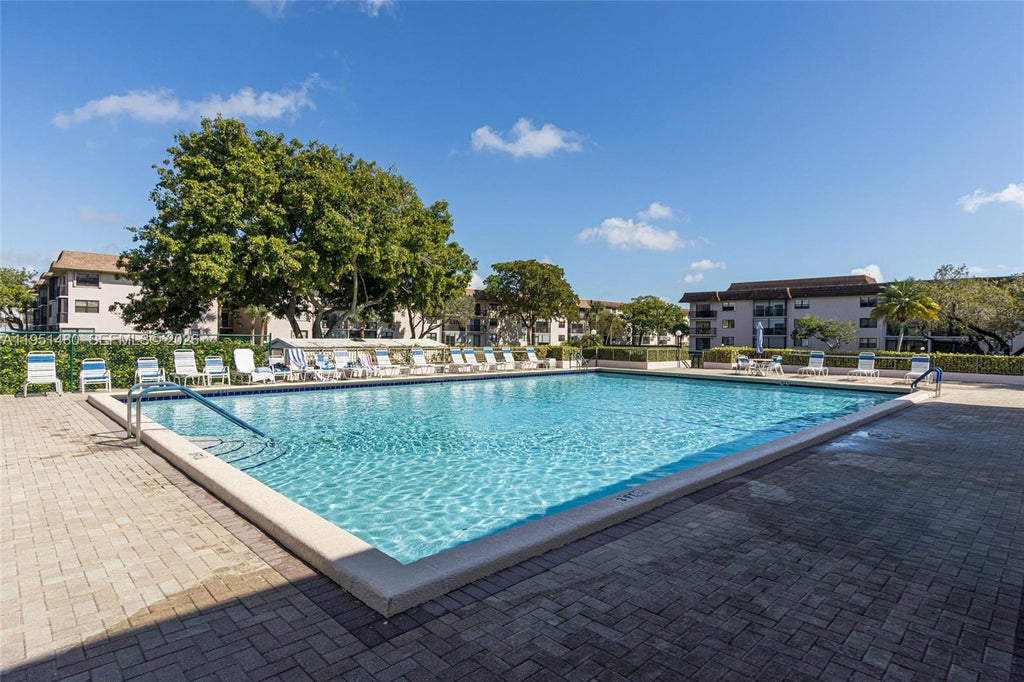 Photo of 6085 N Sabal Palm Blvd #208, Tamarac, FL 33319 (MLS # A11951480)
