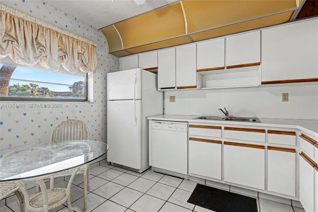 Photo of 6085 N Sabal Palm Blvd #208, Tamarac, FL 33319 (MLS # A11951480)