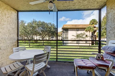 Photo of 6085 N Sabal Palm Blvd #208, Tamarac, FL 33319 (MLS # A11951480)