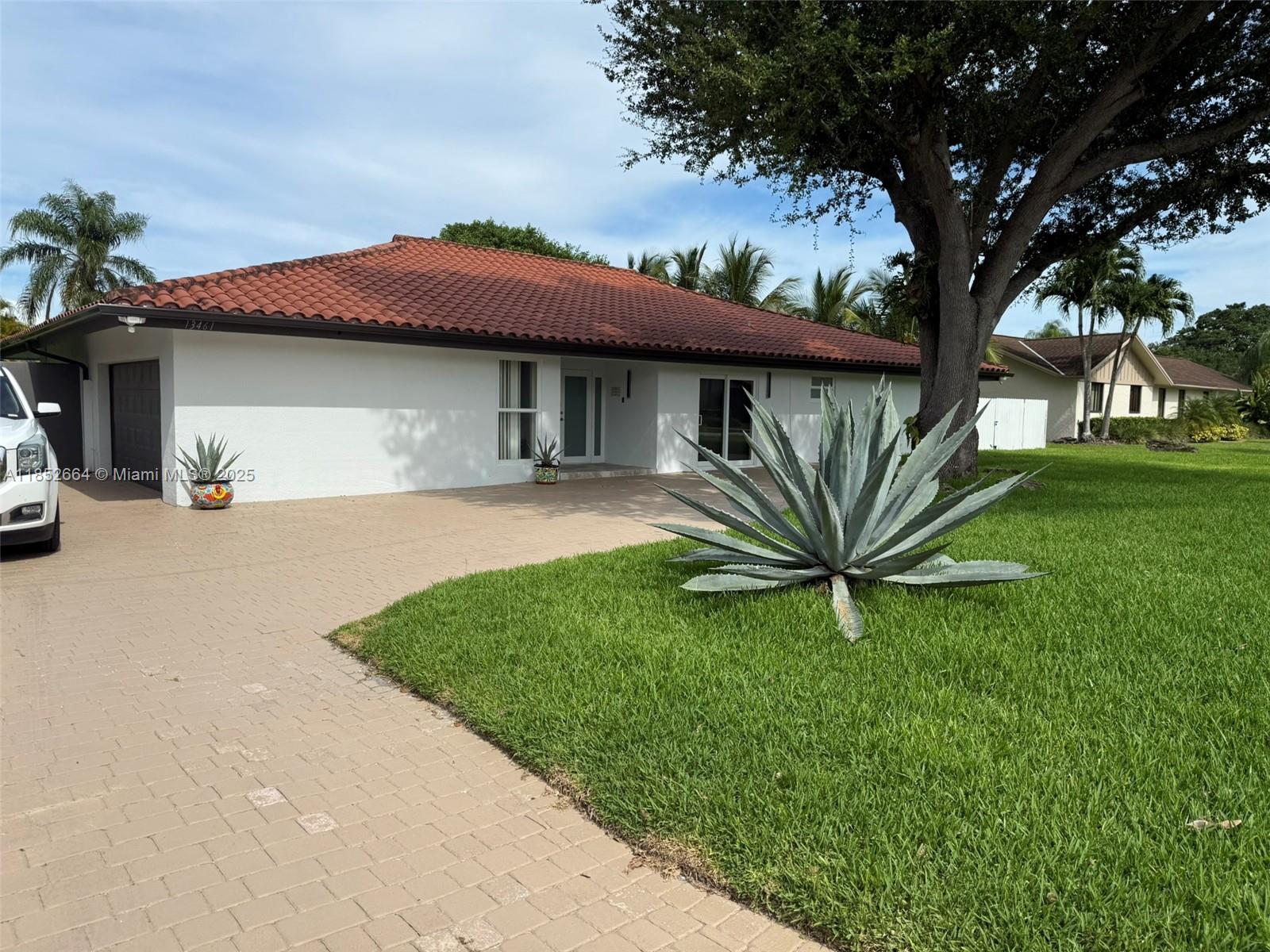Beautifully updated 4 bedroom, 3 bath pool home located in the highly desirable Falls area of Miami. Situated at 13461 SW 98th Place, this home offers approximately 2,417 sq ft of living space on a spacious 0.42-acre lot. Originally built in 1977 and recently remodeled, the home features a heated saltwater pool, impact windows and doors, new appliances, a built-in electric fireplace, new interior doors, and fresh interior paint. Both A/C units are approximately four years old. The garage is equipped with an electric vehicle (EV) charger. Currently used as a short-term rental (Airbnb;VRBO), but easy to show and available for immediate occupancy. No sign on property.