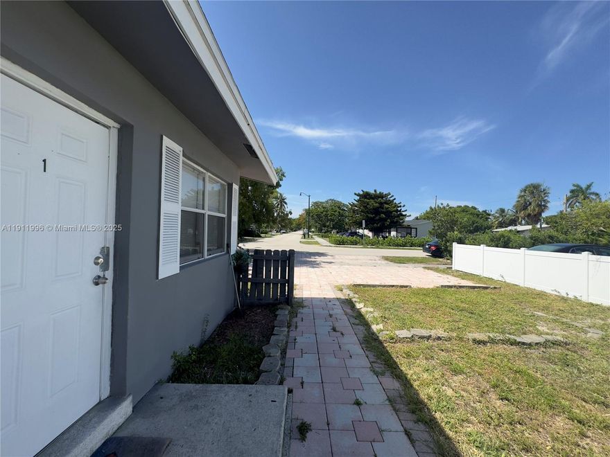 Owner will consider Sec 8 Tenant.  Front Unit duplex THREE BEDROOM, very spacious, 1000 sq ft, & one of the largest close by. Newer ROOF (2021), Newer Central AC Unit, Newer electrical panel, NEW Fence, Newly painted interior & exterior, NEW FULL SIZE WASHER & DRYER, NEW ceiling fans, Granite Countertop, ALL TILE, plenty of closets & storage, NEW toilet, NEW windows, NEW INTERIOR doors, NEW FRONT DOOR & Locks, NEW Blinds, PRIVATE BACKYARD separate from back unit, plenty of parking, across the street from an elementary school, & just west of Fed Hwy, & a few miles to the beach! There is a separate exit door to a FENCED IN YARD, away from the back tenants for activities, & for your dog. Owner will consider 1st mo. rent, & security based upon application. PHOTO OF Bathroom posted soon!