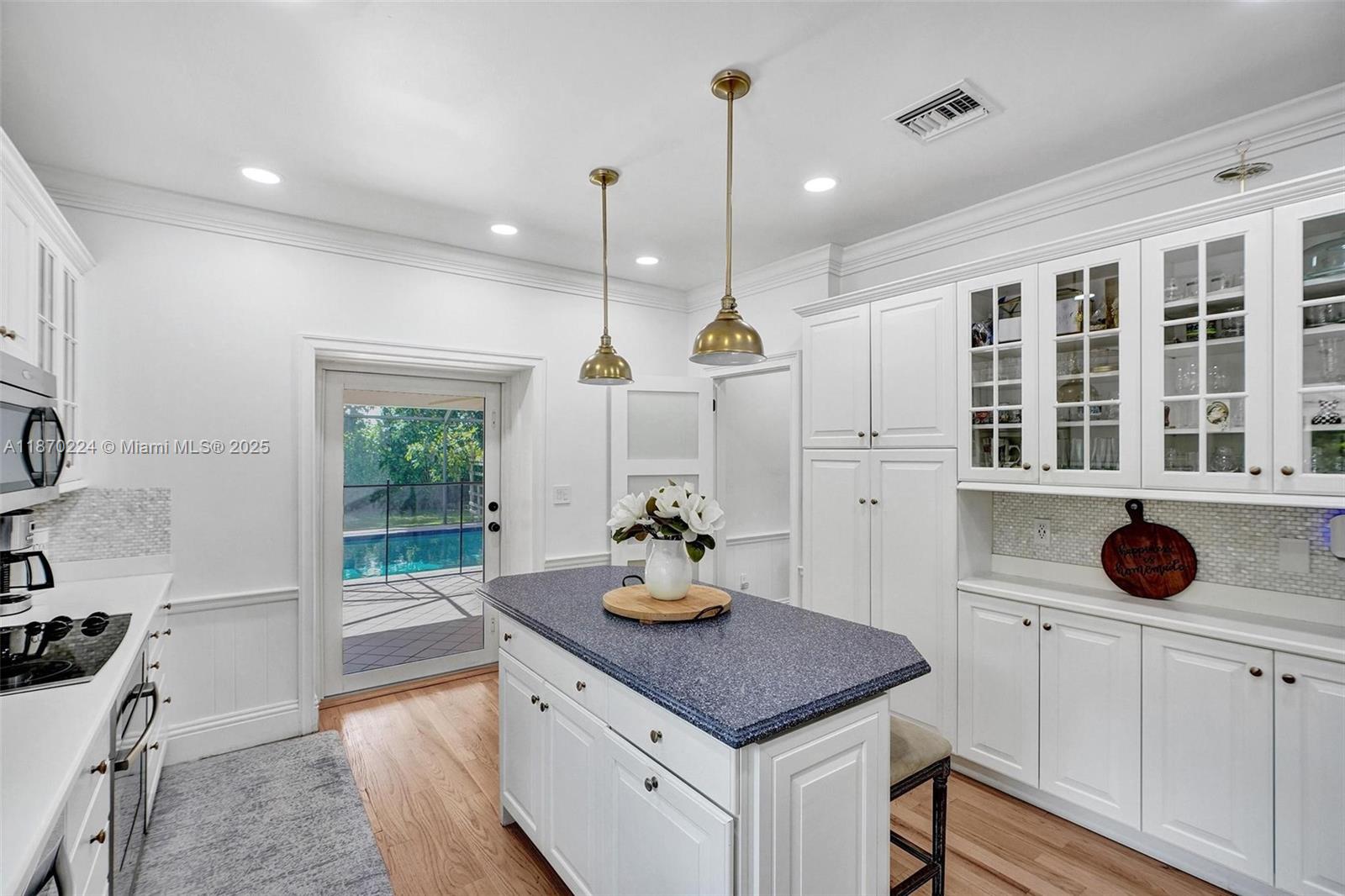 Located in the exclusive gated community of Old Cutler Groves, an enclave of just 16 homes with private roads and two tennis courts, this updated estate offers a rare blend of privacy, space, and flexibility. The main home features a 3-bed, 3-bath split layout with open living areas (3,062 SF per appraisal, larger than tax roll) overlooking the screened pool and lush landscaping. The custom kitchen flows into the family room, perfect for everyday living and entertaining. A spacious, separate guest house makes an ideal in-law suite, office or flex space. Outside, enjoy the pool and spa, expansive patio and mature trees that create a true backyard oasis. With impact windows and doors and a prime location, this is a rare opportunity in one of the most desirable communities east of Old Cutler.