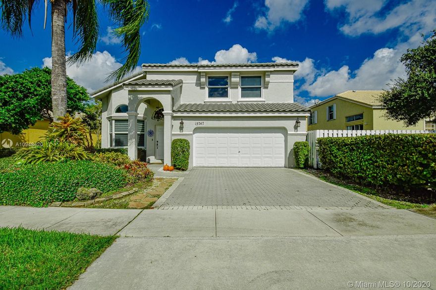 Just remodeled, modern home in the heart of Pembroke Pines. 4 Beds, 2.5 Baths, master bedroom downstairs. In the community of Towngate. Owner have place much love and dedication their home. New roof and impact windows and doors. New modern kitchen, Quartz counter tops. Large waterfall kitchen island, stainless steel appliances with induction cooktop, wall oven and microwave. Large 20x40 porcelain floors in common areas and master bedroom. water proof wood floors in all other rooms.  smooth ceilings with recess lights. Master bathroom updated with dual wall and ceiling showers. Free-standing bathtub, dual sink. Glass and stainless steel stair hand rails. Led lights steps. This home sits on on lakeview lot with plenty of space to add a pool of your choice and size. This home will not last.