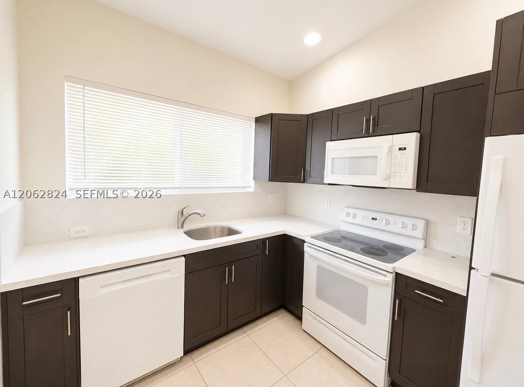 Photo of 3864 SW 48th Ave #3864, Hollywood, FL 33023 (MLS # A12062824)