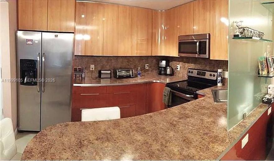 Renovated 1300 SF spacious and bright 1BR + den, 2 full bathrooms at Prince George in Hallandale Beach. The versatile den can be used as a second bedroom, office or guest space. Ideally located across from the ocean and park. Enjoy resort-style amenities including 24/7 concierge, heated pool, gym, sauna, tennis, basketball, paddleball, BBQ area, clubhouse, billiards, and bike storage. Minutes to the Hollywood Beach Broadwalk, dining, shopping, and casinos.