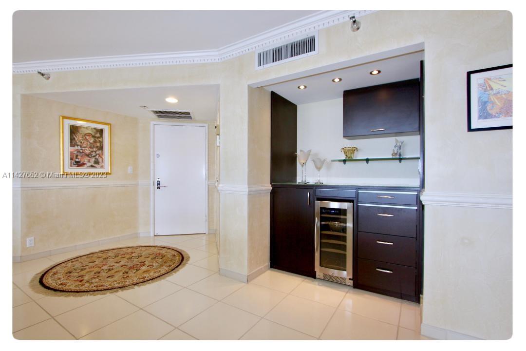 Beautifull corner wrap around 2/2 with den with amazing views of ocean and intercoastal in a full ameneties building with 24 hr valet pool tennis pickaball and fully equipped gym