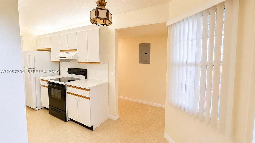 Photo of 12900 SW 13th St #413E, Pembroke Pines, FL 33027 (MLS # A12087296)