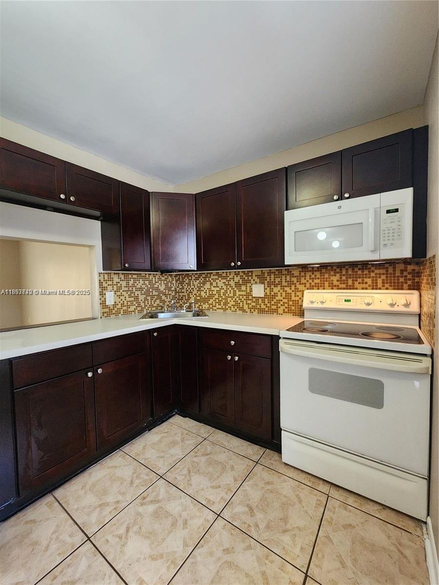 Enjoy resort-style living in the desirable 55+ Bermuda Club community in Tamarac! This beautifully upgraded and freshly painted unit offers a peaceful lake view from your enclosed balcony — the perfect spot to relax and unwind. All special assessments have been paid by the seller, and all work has been completed which offers peace of mind to the renter. Ideally located just minutes from golf courses, Sawgrass Mills, the beach, Fort Lauderdale Airport, and major highways. Residents enjoy a clubhouse, 4 sparkling pools, tennis courts, fitness center, shuffleboard, putting green, billiards, ping pong, and more. A perfect blend of comfort, convenience, and active living!