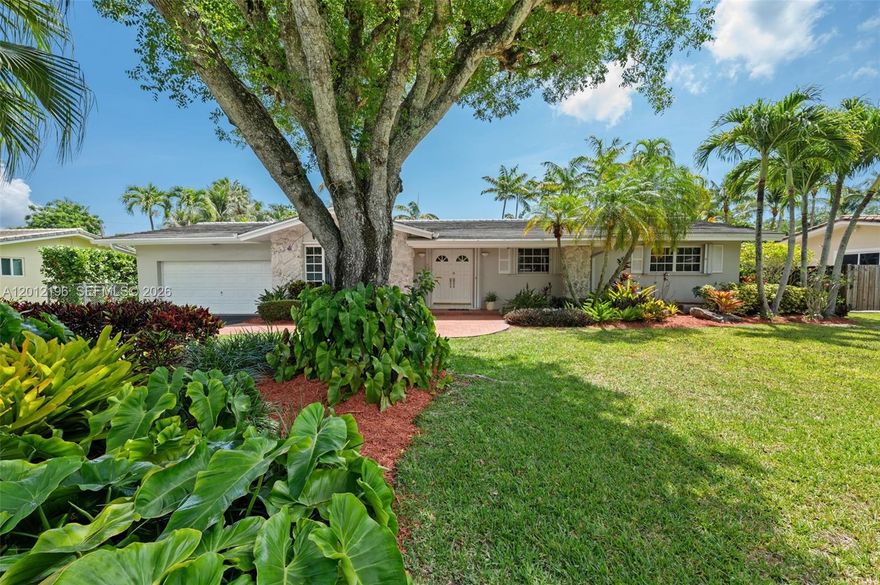 In the heart of Palmetto Bay, just 4 minutes from the bayfront Deering Estate Nature Reserve, this beautifully maintained home is a move-in ready South Florida classic. The layout delivers distinct rooms for relaxing, dining & entertaining, while the wide-open passages & vaulted ceilings afford a wonderful sense of flow & connectivity + a generous sense of space. Light pours into every room thru broad window banks & glass doors, augmented by designer lighting & lighted ceilings fans. Creamy tile floors, along with a crisp white kitchen, boost the light, bright ambiance. You might, however, find yourself spending much more time outside enjoying the large screened patio & swimming pool, as well as the big backyard secluded by a dense privacy hedge. Cabana bath, large laundry, 2-car garage.