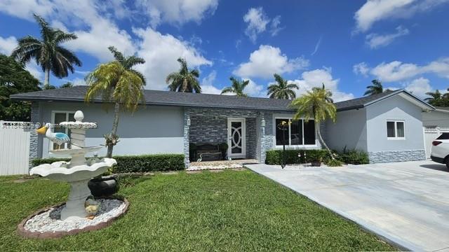 Stunning home with 3 bedrooms, 2 bathrooms, and a private in-law suite with its own entrance - perfect for extended family or guests.
This floorplan offers 1,709 sq. ft. of living area and a lot size of 7,579 sq. ft.
Enjoy open concepts living with a modern kitchen, complete with stainless steel appliances and sleek finishes. The entire home is fitted with impact windows for safety and energy efficiency. New roof installed in 2021.
Step outside to your private backyard retreat, featuring a covered outdoor kitchen and Terraza—ideal for entertaining. Gated backyard access for large vehicles, easily bring in your trailer, RV or boat through a wide gate located at the back of the property.
Near Florida turnpike and US-1, top-rated schools like Coral Reef H. School & Biotech H. School.