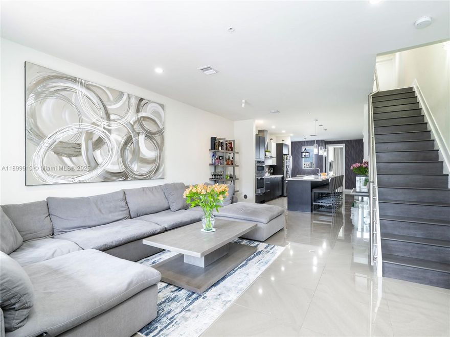 Exceptional opportunity to own in Landmark, one of Doral’s most sought-after communities. This modern three-story condo offers 1,923 Sq.Ft. of stylish living with 3 bedrooms, 2.5 baths, and a private one-car garage. Enjoy open, light-filled interiors, elegant porcelain flooring, and a chef’s kitchen with premium appliances, a large quartz island with seating for six, and a built-in wine cooler. The primary suite features a spacious walk-in closet and spa-style bath with dual floating vanities and a glass-enclosed shower. Residents have access to Landmark’s luxurious clubhouse with a resort-style pool, fitness center, and social areas designed for modern living. Please note that this sale is subject to buyer granting seller a 12-month post-occupancy period; lease price included.