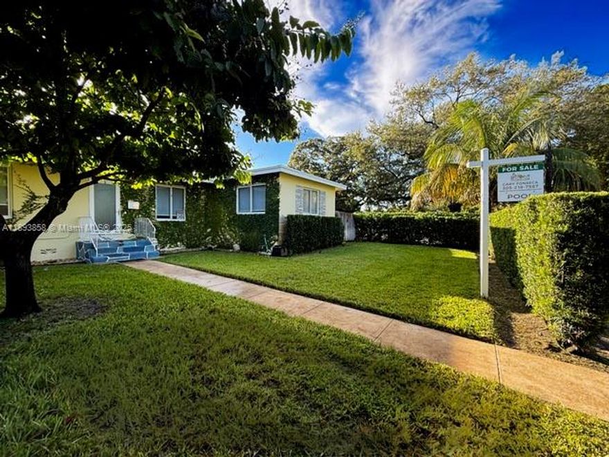 This beautifully crafted 2-bedroom, 2-bath home in historic Griffin Park Estates sits on a ¼-acre lot. Inside, original hardwood floors complement a custom kitchen with quartz countertops and high-end gas appliances. Enjoy spa-like Carrera marble baths, a six-seat bar, and smart home features with a full security system. Outside, relax in a tropical oasis with a saltwater pool, hot tub, Trex decking, and covered lounge. Hurricane impact windows, a whole-home generator, new HVAC, and lush landscaping make this home a rare find.