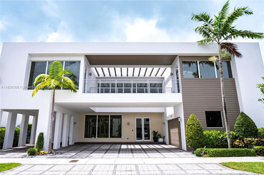 Stunning and impeccable home at the prestigious Modern Doral 75. This smart home has 6 bedrooms and 7 full bathrooms, marble and wood floors, high ceilings, impact windows, kitchen with top-of-the-line stainless steel appliances, glass and steel staircase railing, garage space for 2 cars and additional 5 parking spaces in the driveway. Great backyard waterfront to the lake with built-in BBQ, sink, and refrigerator. A significant highlight of this property is its solar panels, offering an autonomous energy source and resulting in considerable savings on electricity bills. Modern Doral is a full-service community, offering club house, fitness center, children's playground, pool, spa, gym, business community, media center and a children's room, gated community 24/7 security, MUST SEE IT!!!