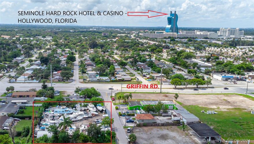 Great investment opportunity! Currently generating $10,000 monthly as boatyard/storage! Just S off Griffin Rd, easy access to Turnpike, airports, I-95, and 595. Rapidly developing, high-traffic area with lots of new commercial and residential. Zoned I-G (flexible development potential) and fantastic for light industrial, manufacturing, bakery, catering, fleet parking, distribution, warehousing, or just continue taking advantage of current great monthly income. Property is fully fenced. Earn 3%+ CAP RATE as you wait to build out your new investment! Close to Hard Rock Hotel and new opportunity zones!