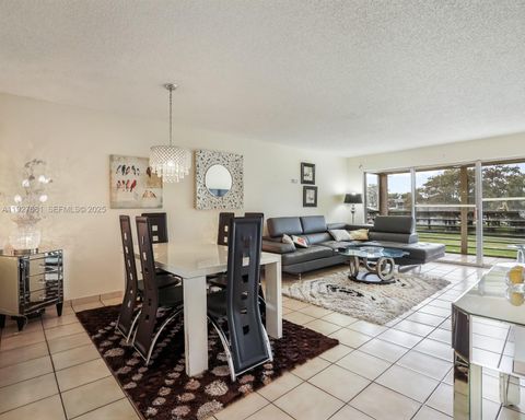 Photo of 8320 Sands Point Blvd #M301, Tamarac, FL 33321 (MLS # A11927081)