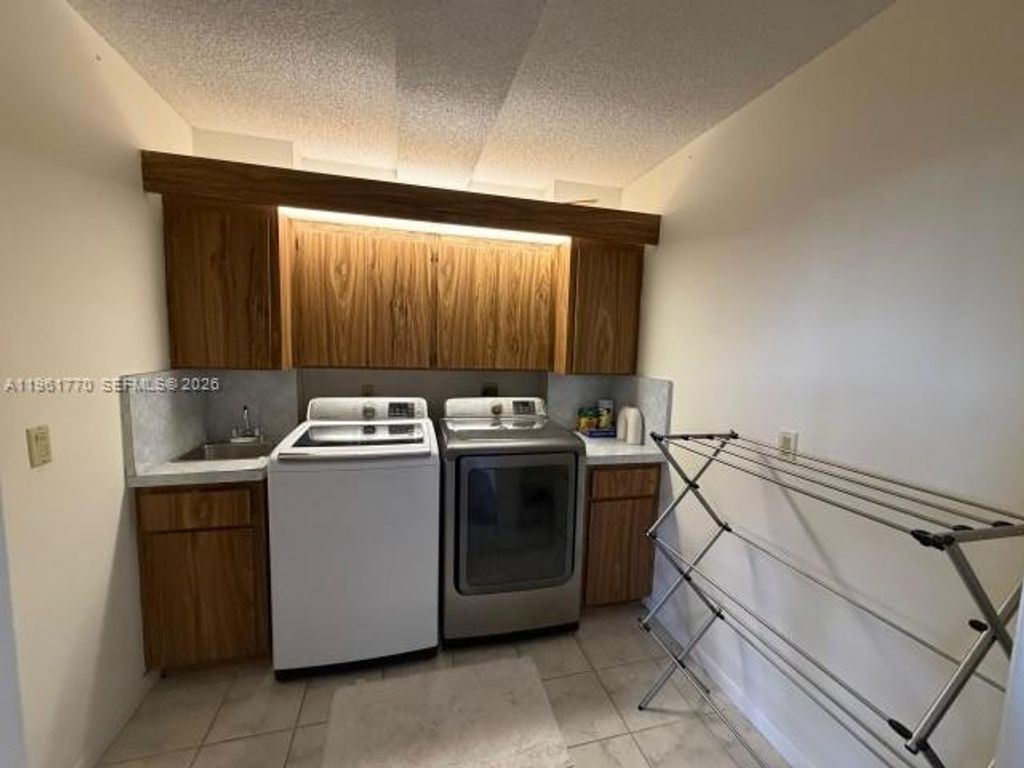 Photo of 1717 Whitehall Dr #401, Davie, FL 33324 (MLS # A11961770)