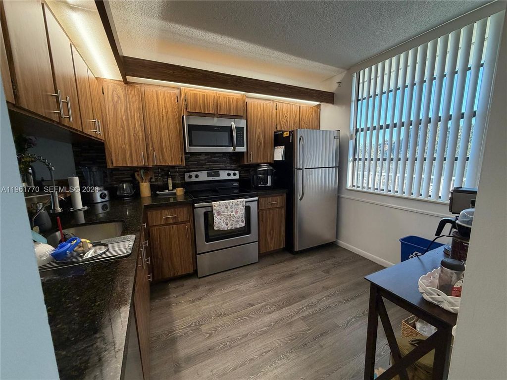 Photo of 1717 Whitehall Dr #401, Davie, FL 33324 (MLS # A11961770)