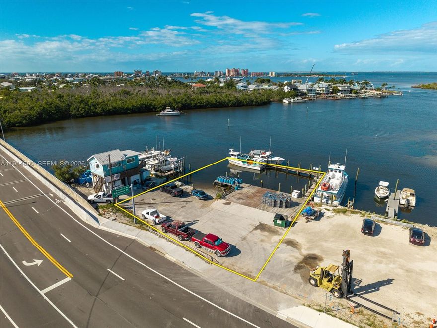 Prime Bayfront Commercial Property – Minutes from Fort Myers Beach! Located on San Carlos Blvd, just one mile from downtown Fort Myers Beach, this waterfront commercial parcel offers direct Gulf access and endless potential. Surrounded by successful marine and tourism businesses—fishing charters, boat rentals, parasailing, tiki tours—this site ensures high visibility and synergy. Within walking distance to restaurants and bars, with owned submerged land and a large dock ready for immediate use, it’s ideal for marine, hospitality, or eco-tourism ventures. Rare investment in a thriving coastal corridor.