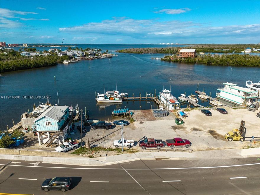 Prime Bayfront Commercial Property – Minutes from Fort Myers Beach! Located on San Carlos Blvd, just one mile from downtown Fort Myers Beach, this waterfront commercial parcel offers direct Gulf access and endless potential. Surrounded by successful marine and tourism businesses—fishing charters, boat rentals, parasailing, tiki tours—this site ensures high visibility and synergy. Within walking distance to restaurants and bars, with owned submerged land and a large dock ready for immediate use, it’s ideal for marine, hospitality, or eco-tourism ventures. Rare investment in a thriving coastal corridor.