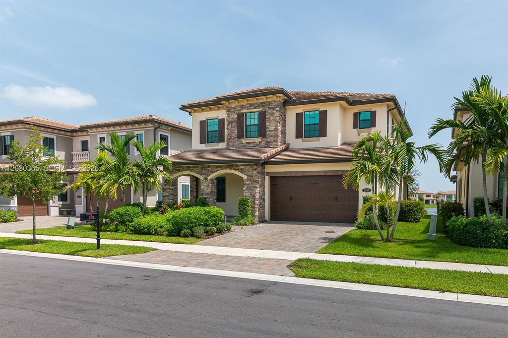 Photo of 9350 Solstice Cir, Parkland, FL 33076 (MLS # A12030365)