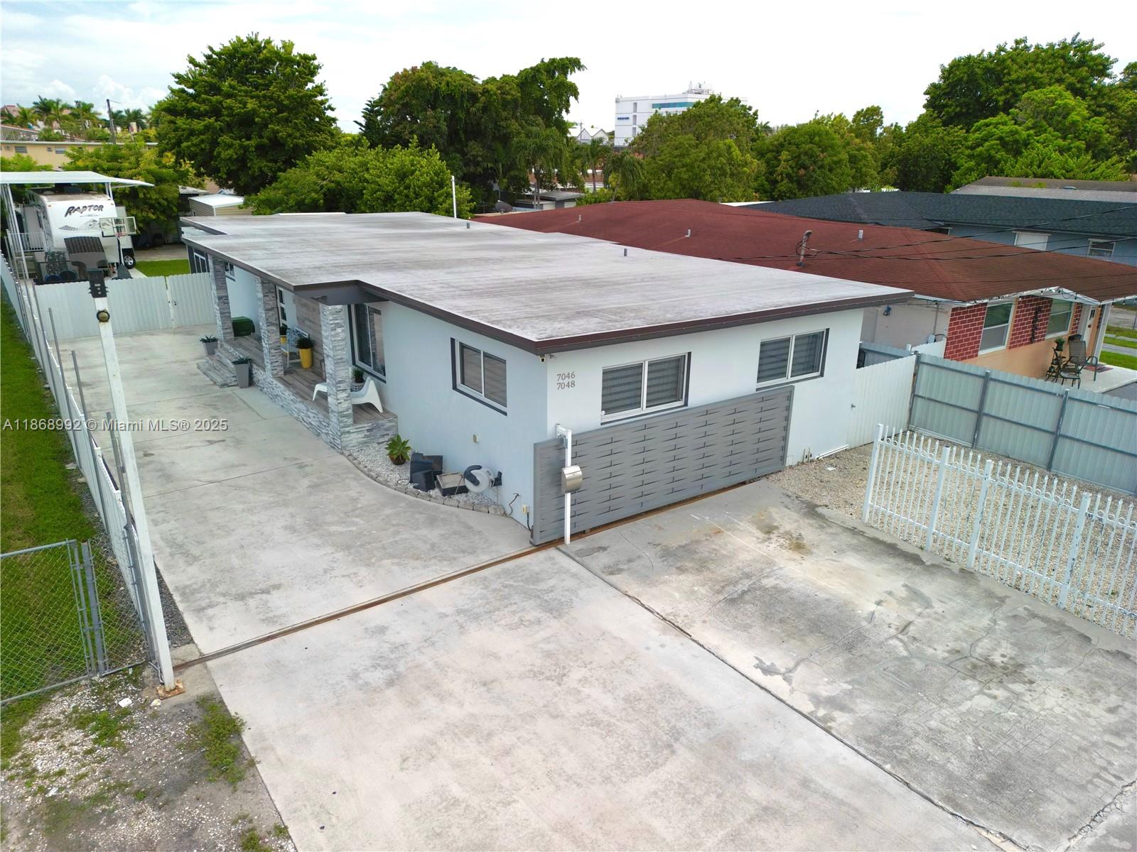 Prime location! Turn-key duplex with additional income, ideal for investors. This property features a 3/2 unit and a 1/1 unit, each with separate electric and water meters as well as their own gas tanks for appliances. Completely renovated with top upgrades including a 2024 roof, impact windows, modern kitchens and bathrooms, and elegant porcelain floors. Situated on a huge lot, offering potential for additional development. Both units are ready to generate income from day one — a truly unique investment opportunity in one of the most desirable areas.