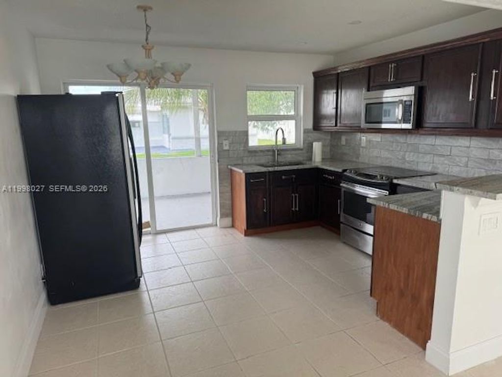 Photo of 7005 NW 66th Ter, Tamarac, FL 33321 (MLS # A11998027)