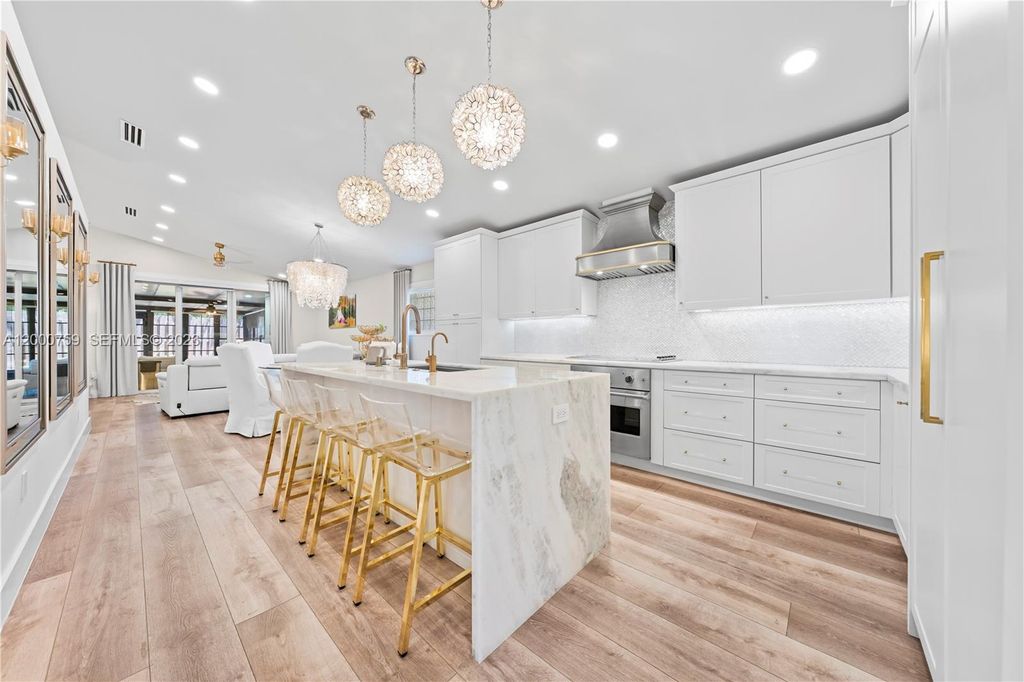 Photo of 1077 NW 170th Ave, Pembroke Pines, FL 33028 (MLS # A12000759)