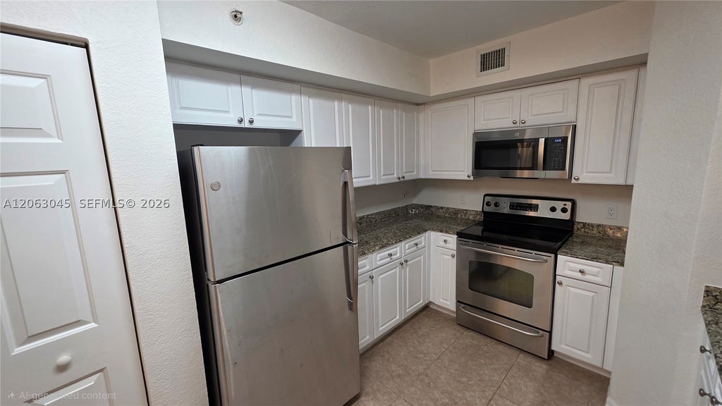 Photo of 6768 Heritage Grande #208, Boynton Beach, FL 33437 (MLS # A12063045)