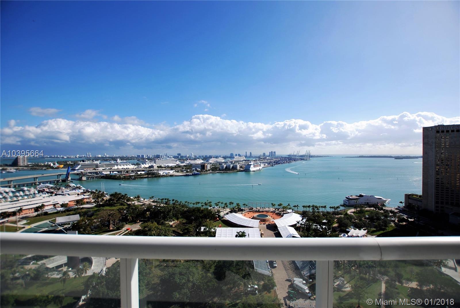 Beautiful 3 bedroom 2 bathroom corner unit with amazing direct views of Biscayne Bay and Bayfront Park. This spacious unit has a large wrap-around balcony and features include porcelain tiles throughout and a fully remodeled kitchen. The building offers resort style amenities such as a spa, massage rooms, pilates room, yoga room, fitness center, party rooms and a large pool deck with cabanas, lounge beds and jacuzzi. Central Downtown location. Walking distance to shopping, dining and more