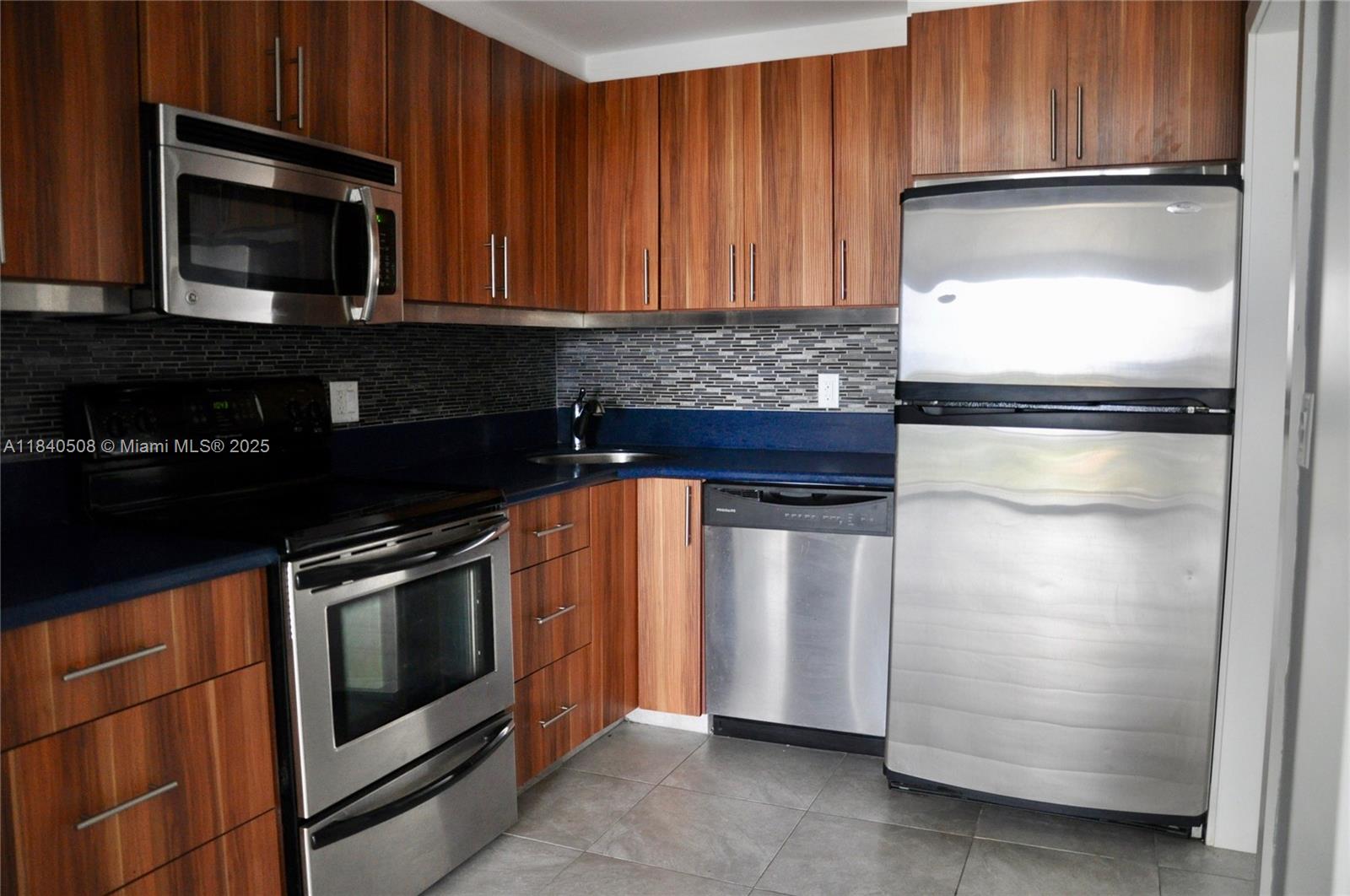 Beautiful renovated large 1 bedroom 1 1/2 bathroom apartment with tile flooring throughout and stainless steel appliances, open view, and a great location, just a few minutes to Bal Harbour, Aventura, FUI North Campus, Barry University, etc. Walking distance to Starbucks, restaurants, and shopping center. One parking spot assigned. Laundry facility in each floor. Minimum 680 credit score required by HOA.